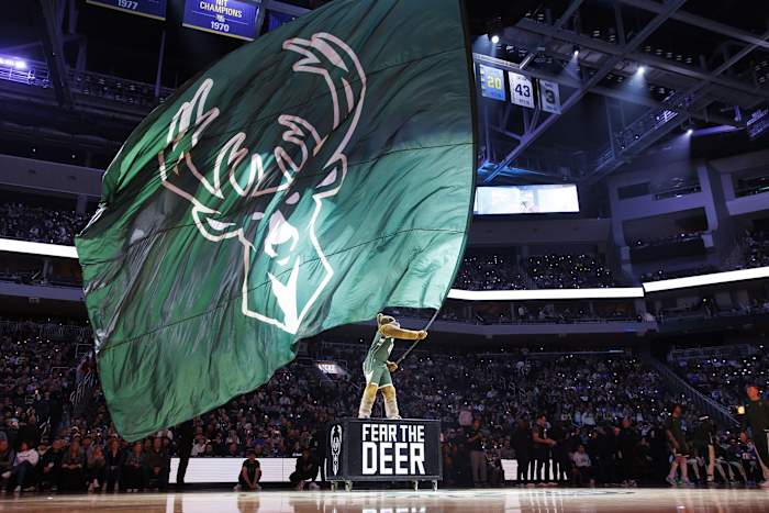 Milwaukee Bucks mascot Bango wave a Milwaukee Bucks flag